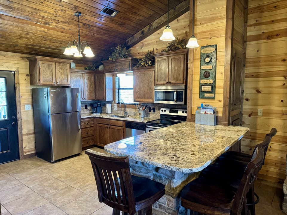 Fully stocked kitchen with granite countertops