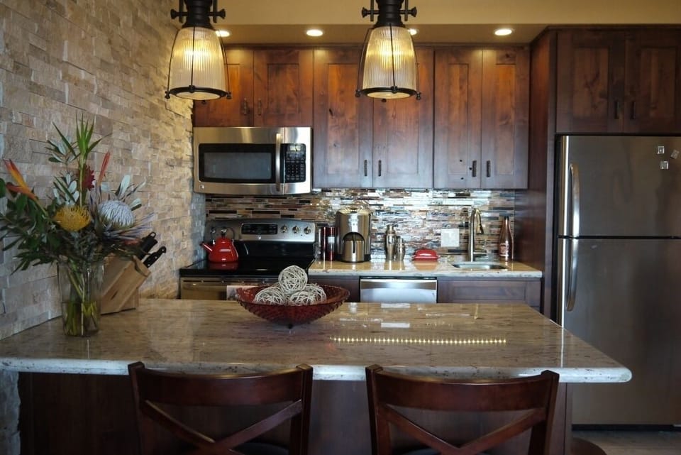 Granite counter tops, custom wood cabinets and Italian tile backsplash