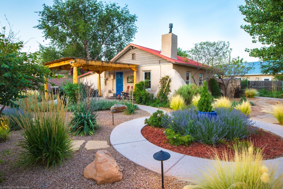 Completely landscaped grounds. View of north patio and pergola.