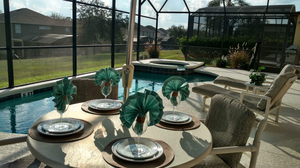 Enjoy dining poolside after a great day at the local parks.