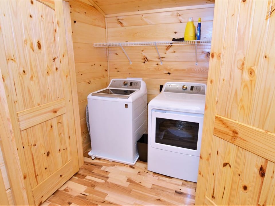 New GE digital washer & dryer tucked away in a separate laundry area
