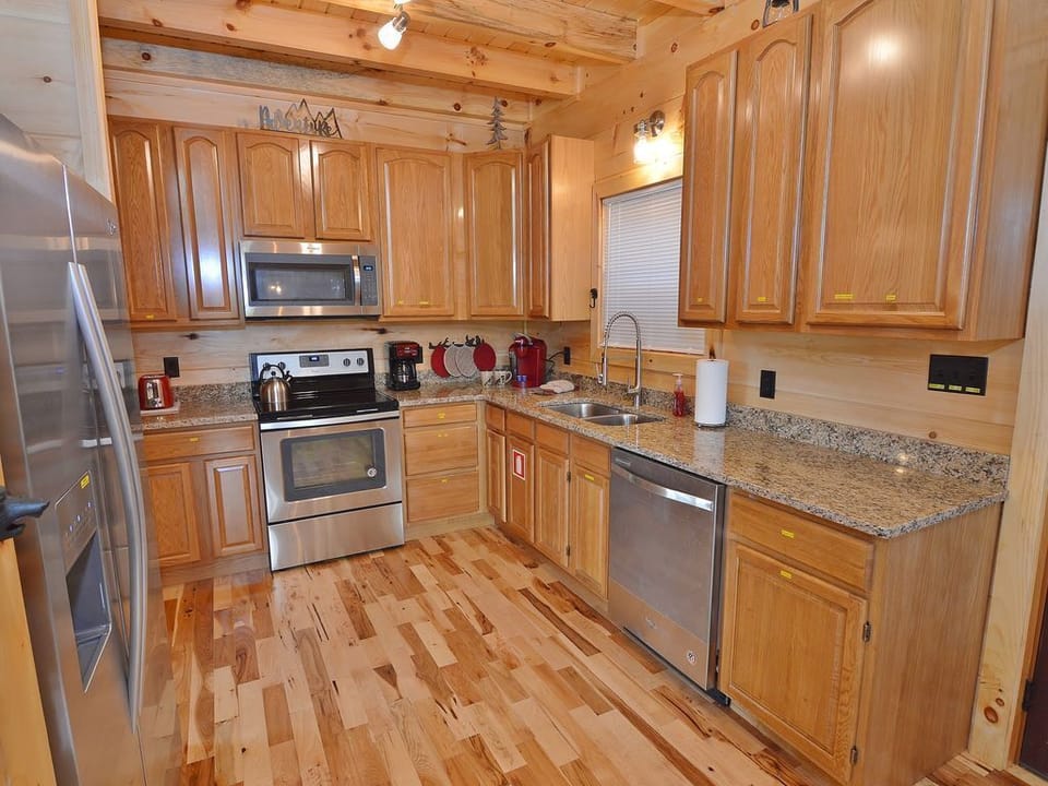 Spacious granite counter top & solid oak cabinets highlight this luxury kitchen!