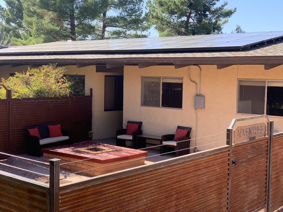 Fully fenced private yard with patio and fire pit. 