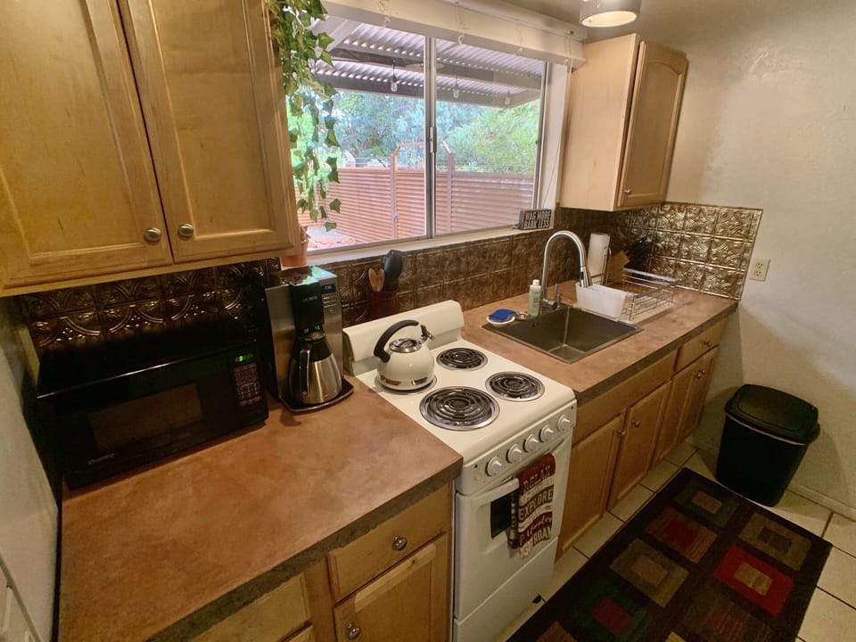 Kitchenette with everything you need to dine in. 