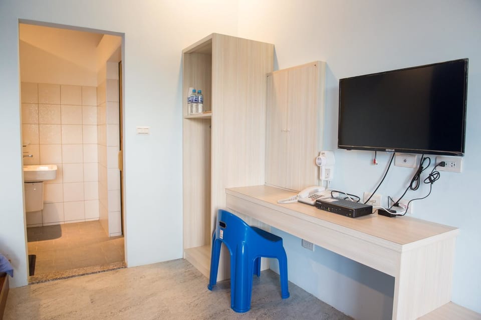 Classic Quadruple Room | Living area | LCD TV