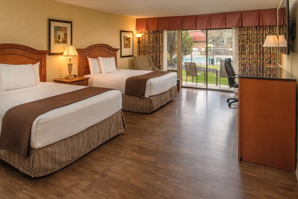 Premium bedding, desk, laptop workspace, iron/ironing board