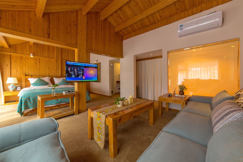 Boutique Suite With King Bed  | Living area | Flat-screen TV