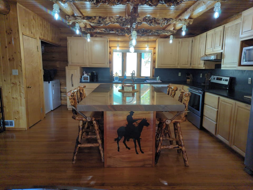 Large kitchen with island. Upgraded lights. dishwasher and washer and dryer.