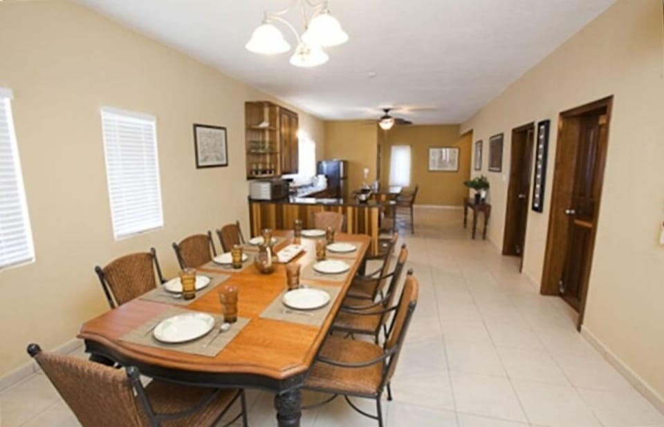 Tommy Bahama dining room table and chairs that seats 8
