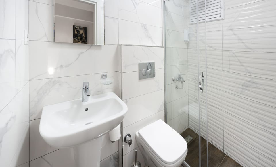 Economy Double Room (Basement) | Bathroom | Shower, free toiletries, hair dryer, towels