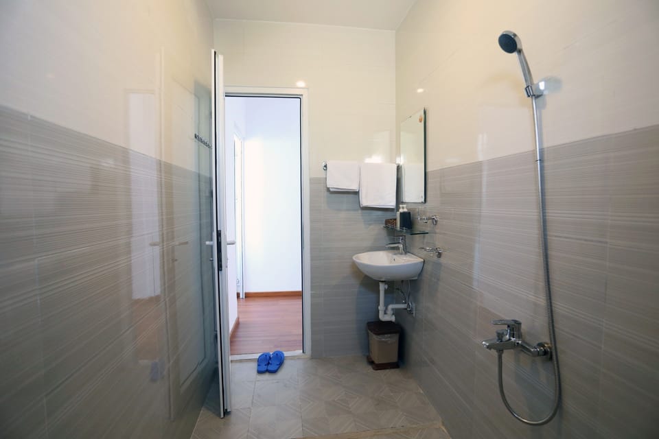 Shower, free toiletries, slippers, towels