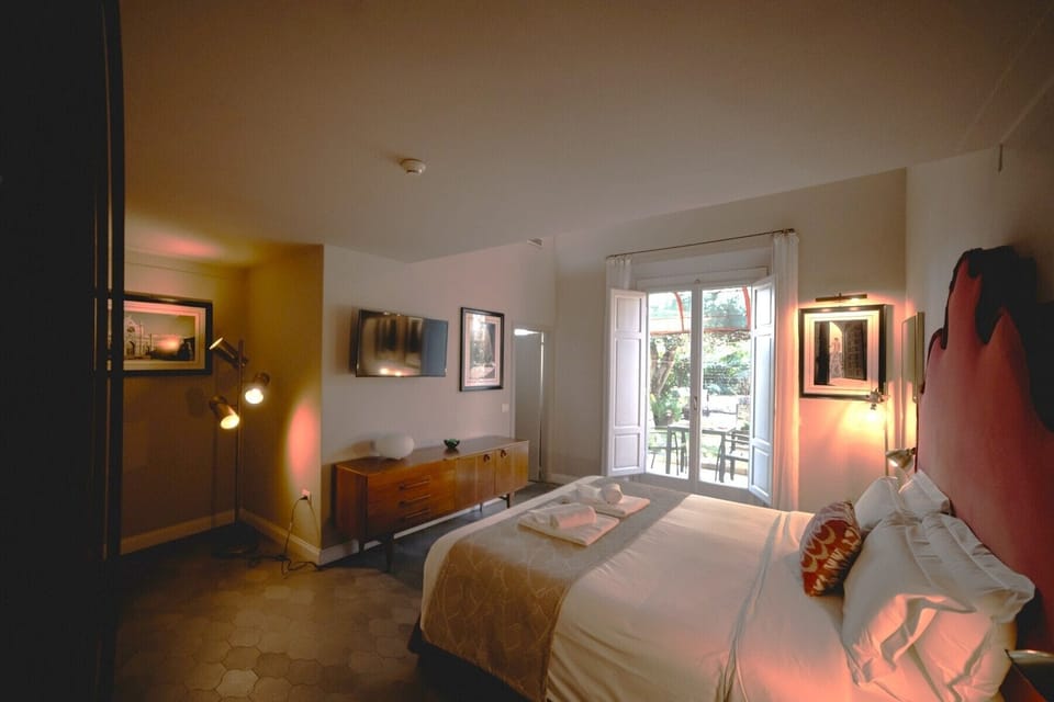 Family Room, Garden View | Pillowtop beds, minibar, in-room safe, desk