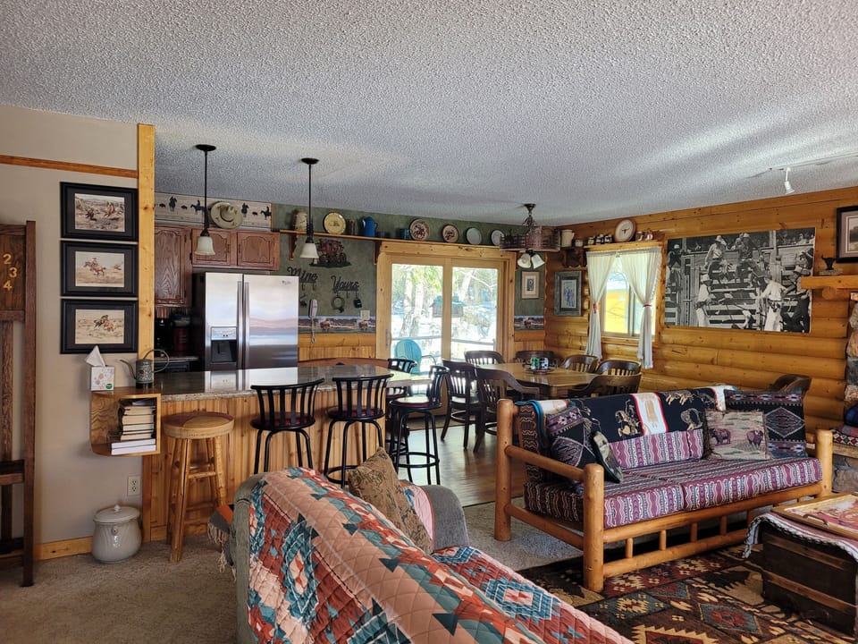 living room and dining area.  Seats 8 at table and 4 at bar.  Extra table leaves