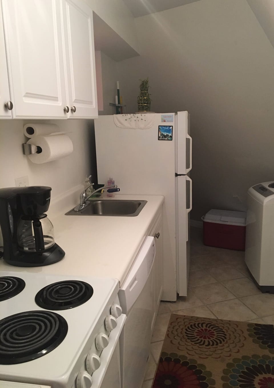 fully equipped kitchen with washer and dryer