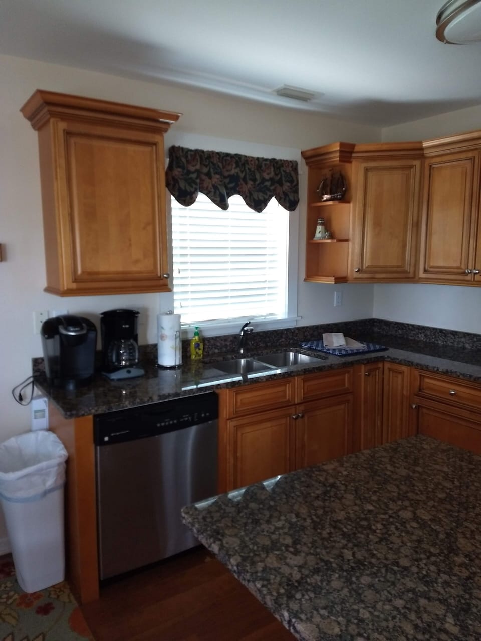 Kitchen with loads of courtesy spices and goodies, open to dining and living rm