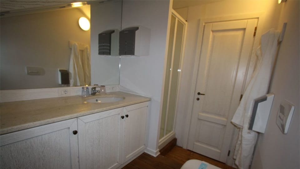 Shower, free toiletries, hair dryer, slippers