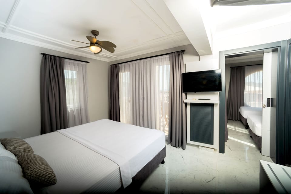 Suite, 2 Bedrooms | Minibar, in-room safe, soundproofing, free cribs/infant beds