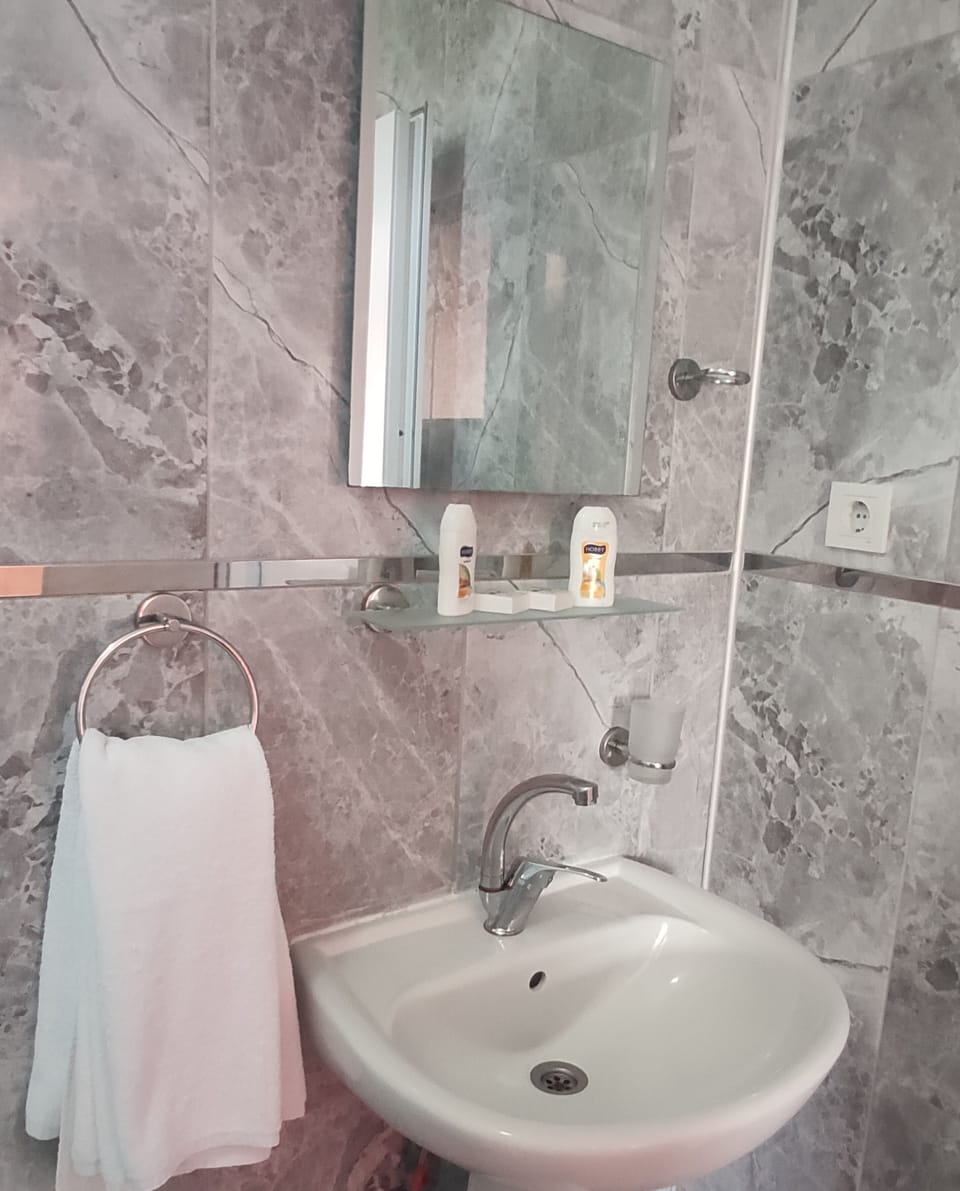 Shower, hair dryer, towels, toilet paper