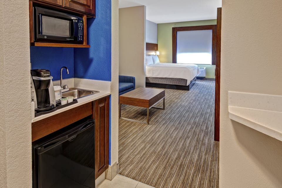 Suite, 1 King Bed | In-room safe, iron/ironing board, free cribs/infant beds, rollaway beds