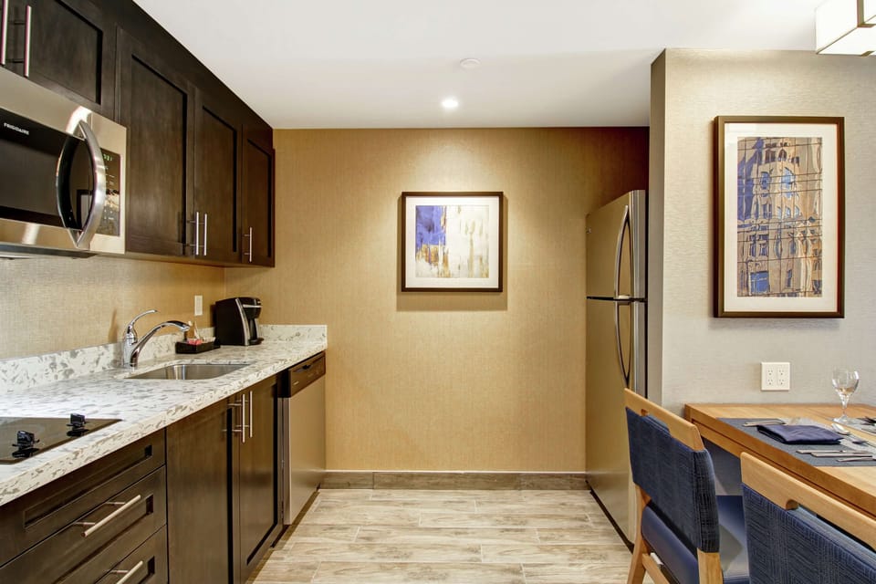Suite, 2 Bedrooms, Non Smoking (1 King & 2 Queen Beds) | Private kitchen | Full-size fridge, microwave, dishwasher, coffee/tea maker