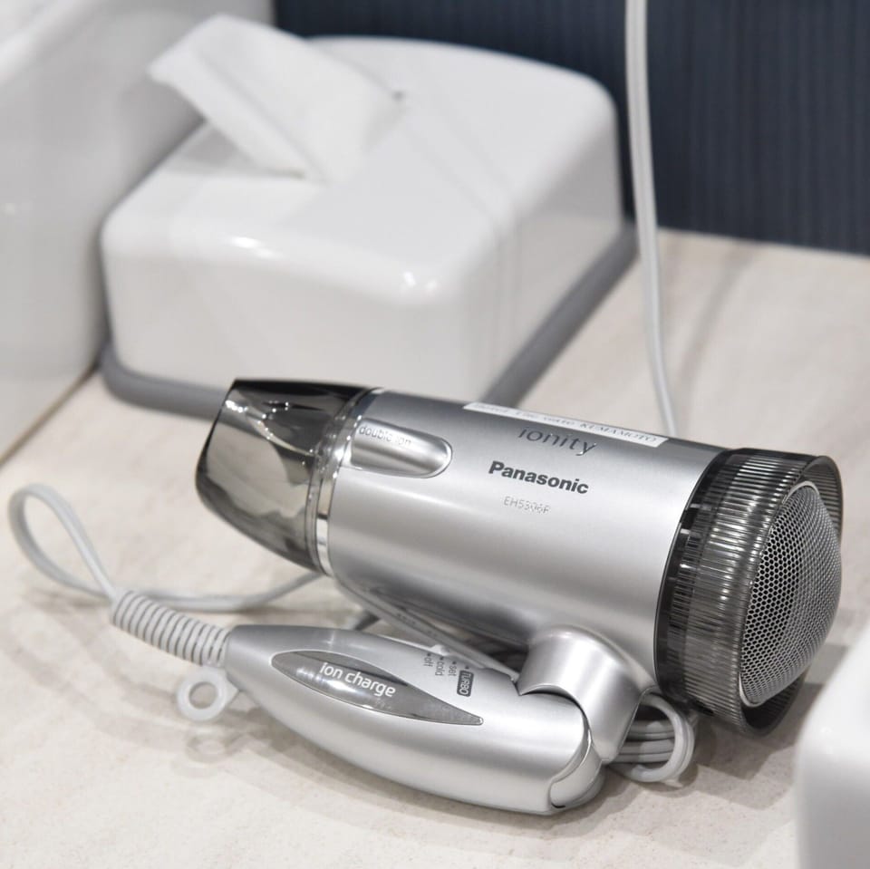 Shower, free toiletries, hair dryer, slippers