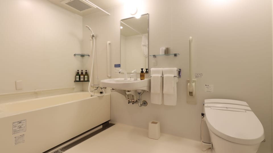 Twin Room, 2 Double Beds | Bathroom | Free toiletries, hair dryer, slippers, bidet