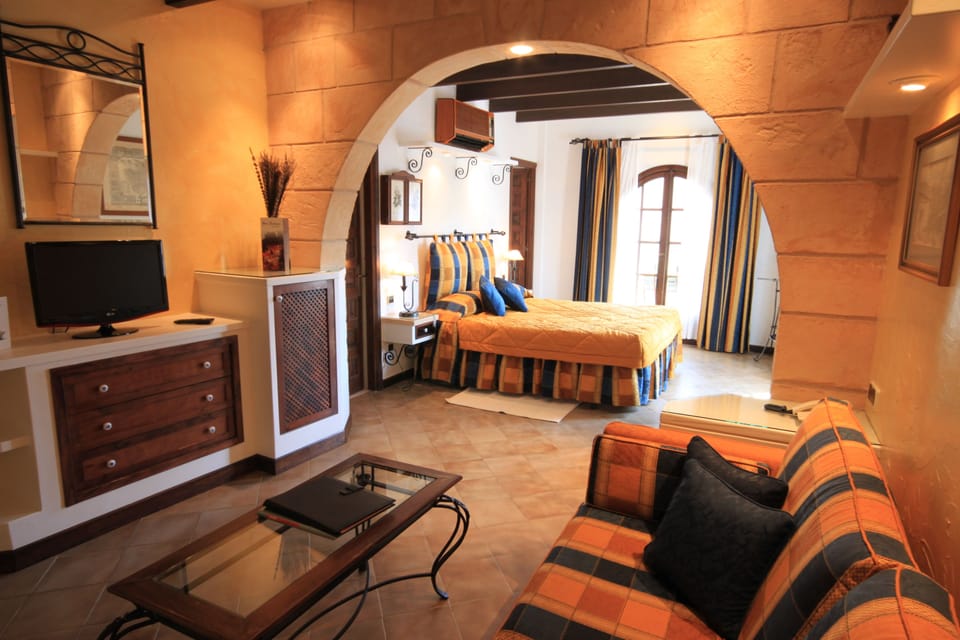 Junior Suite, Balcony | Memory foam beds, minibar, in-room safe, desk