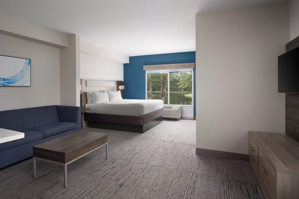 Suite, 1 King Bed with Sofa bed (Additional Living Area) | In-room safe, desk, iron/ironing board, cribs (free)