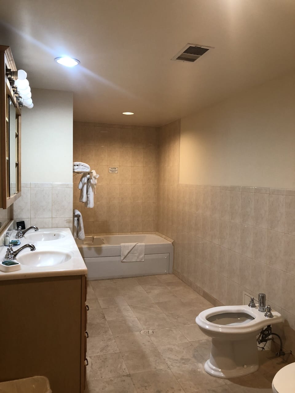 Standard Suite, 1 King Bed | Bathroom | Combined shower/tub, free toiletries, hair dryer, towels
