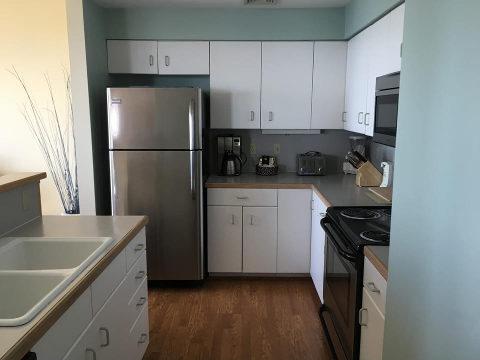 Well stocked kitchen with new appliances.