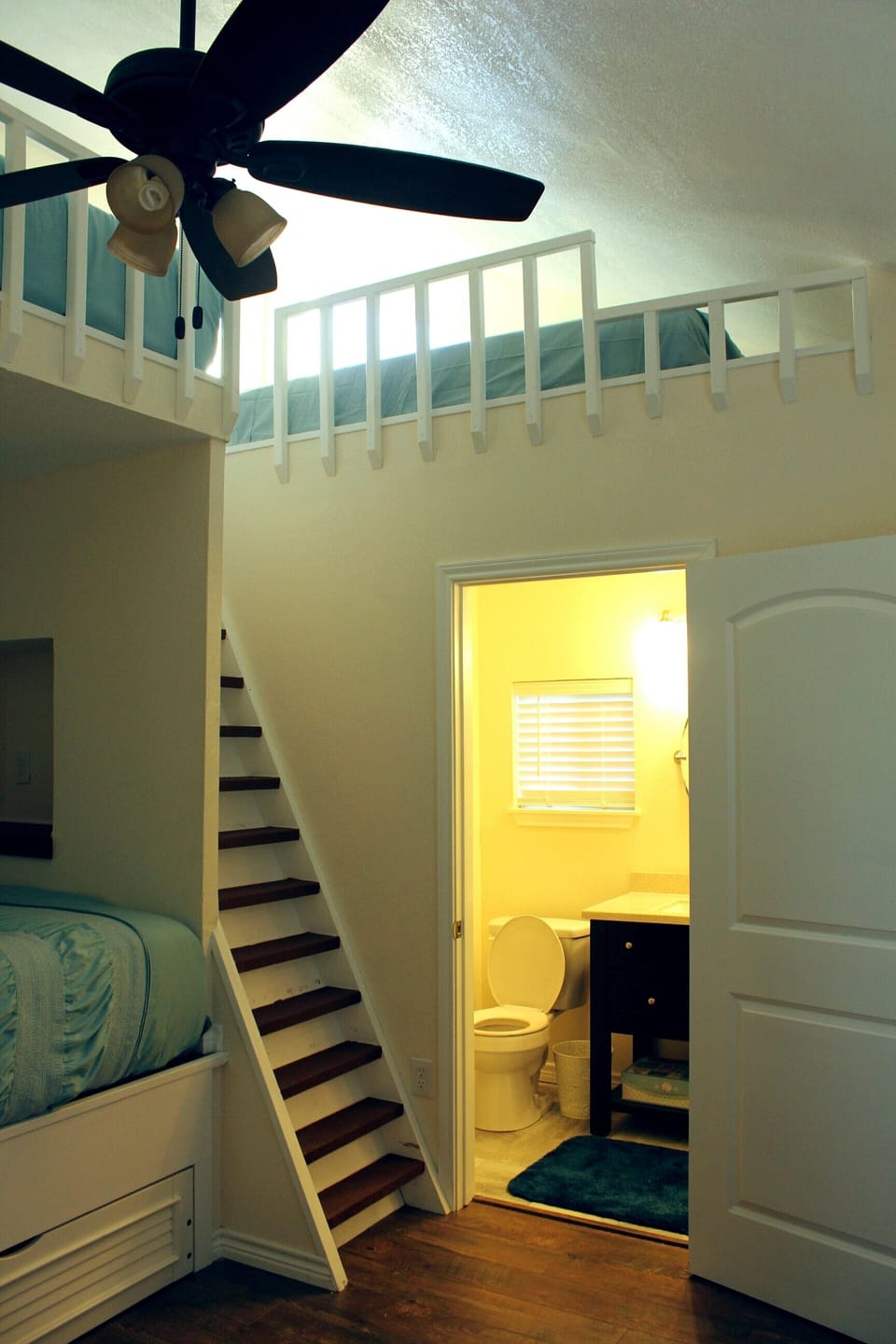 Full sized bed in the Crow's nest with view of the water