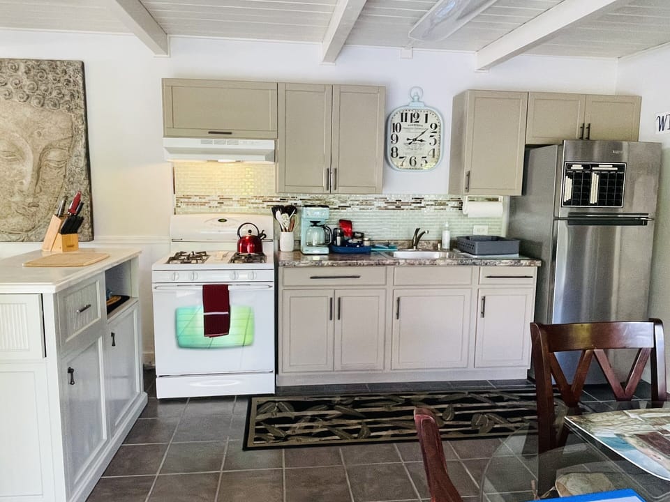 Fully equipped kitchen with gas stove and oven
