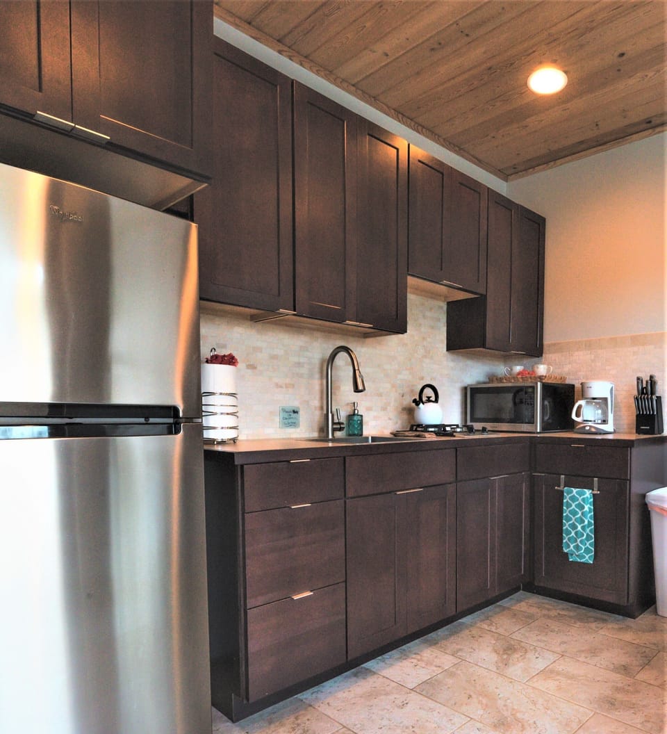 Kitchen includes 3/4 size fridge.