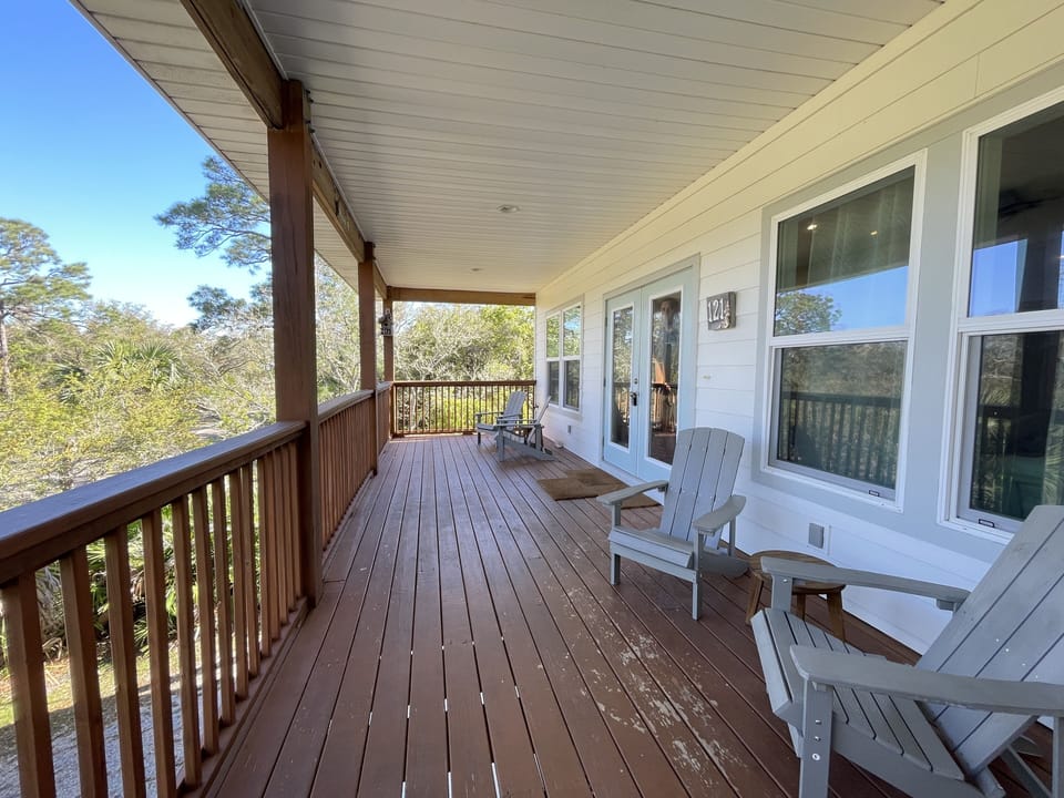Elevated front porch nestled in the trees 