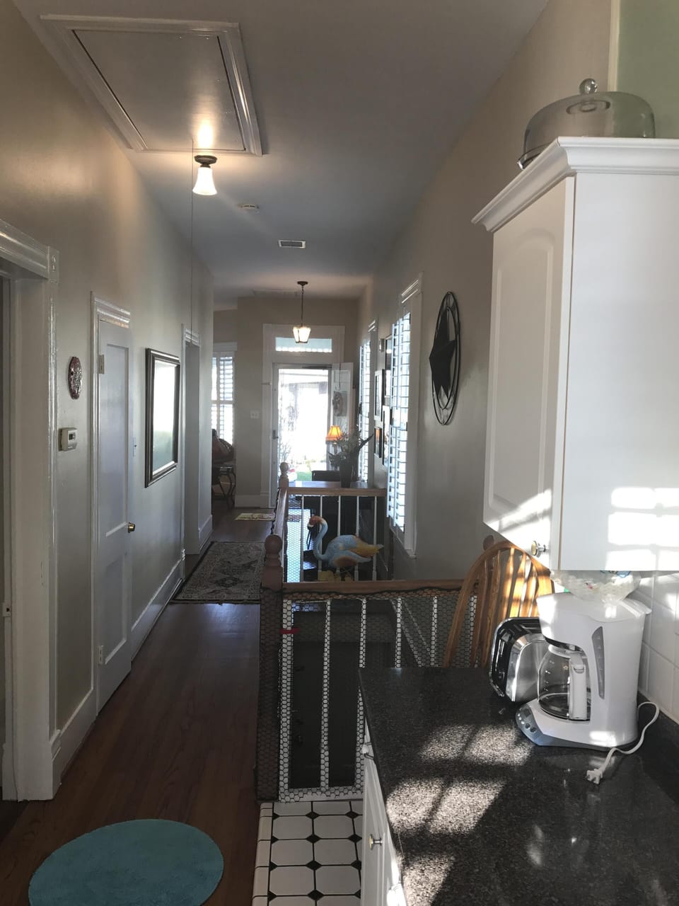 View from kitchen to front door. Side hallway