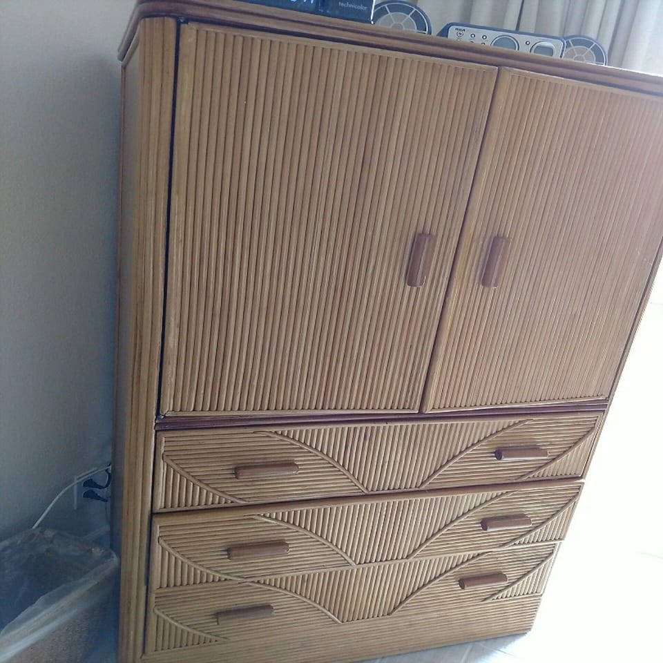 Armoire houses TV and good sized drawers