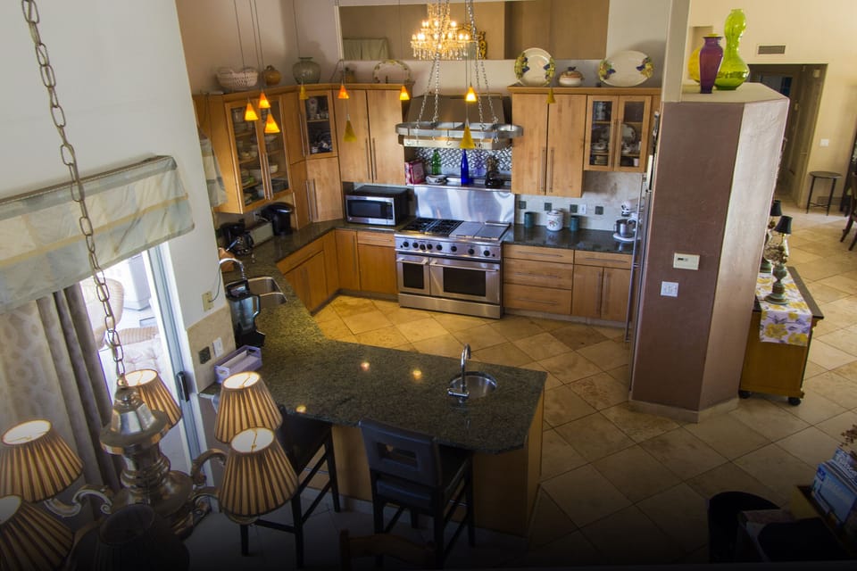 View of kitchen from upper family room