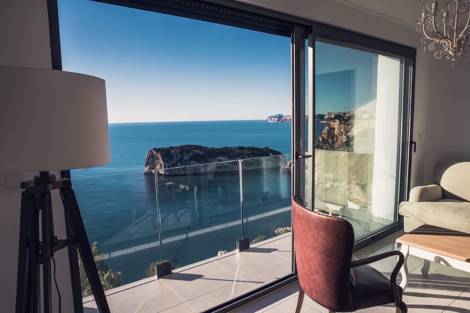 Floor to ceiling sliding doors and balcony in second living room (level 2)
