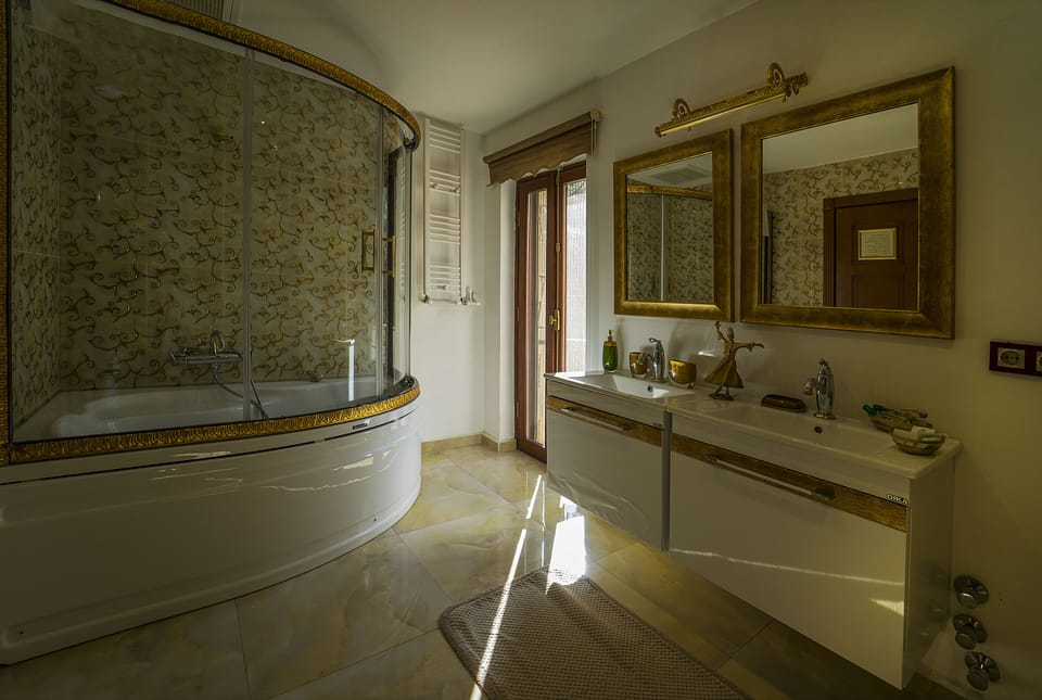Deluxe Suite, 2 Bedrooms, Accessible, Partial Sea View | Bathroom sink