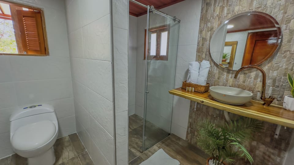 Family Suite, Multiple Beds, Garden View | Bathroom | Shower, rainfall showerhead, eco-friendly toiletries, towels