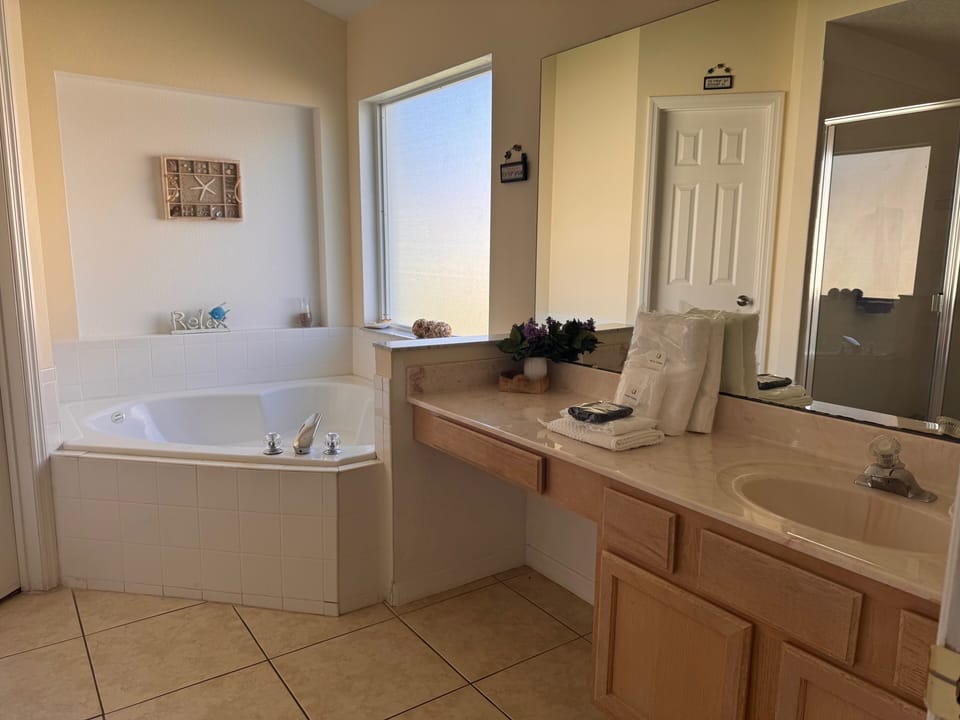 Elegant Master Ensuite Featuring Corner Bath, Walk-In Shower & Dressing Space