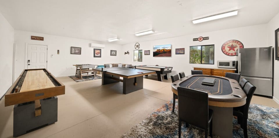 [Game Room] Featuring shuffleboard, poker table, air hockey, ping pong, foosball, smart TVs, with a fridge and microwave tool