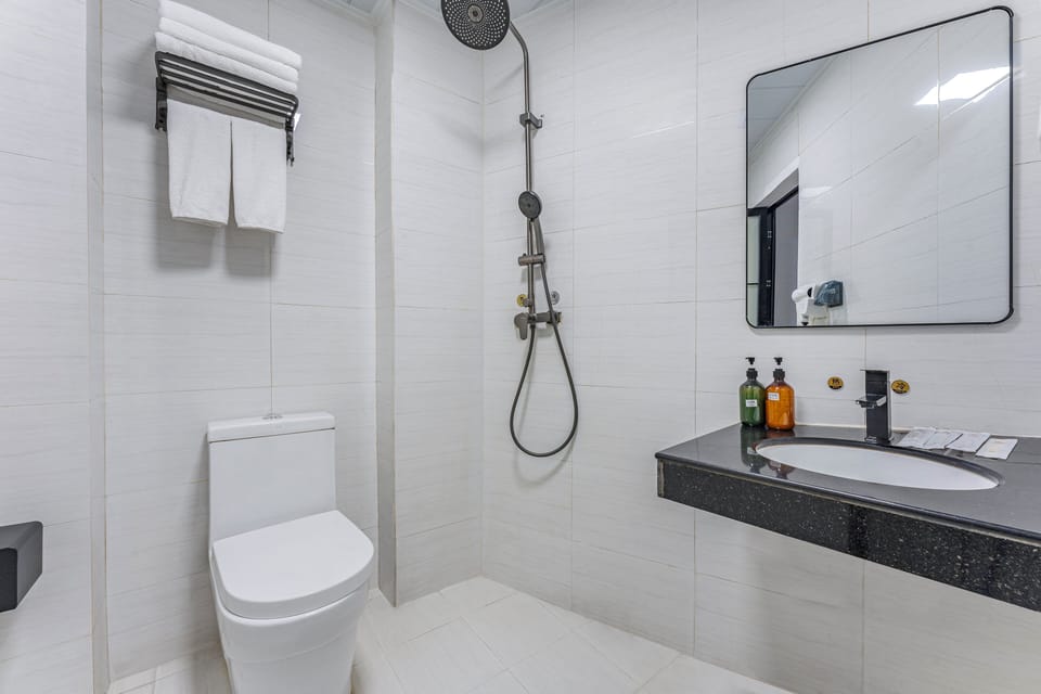 Business Suite  | Bathroom | Shower, free toiletries, hair dryer, slippers