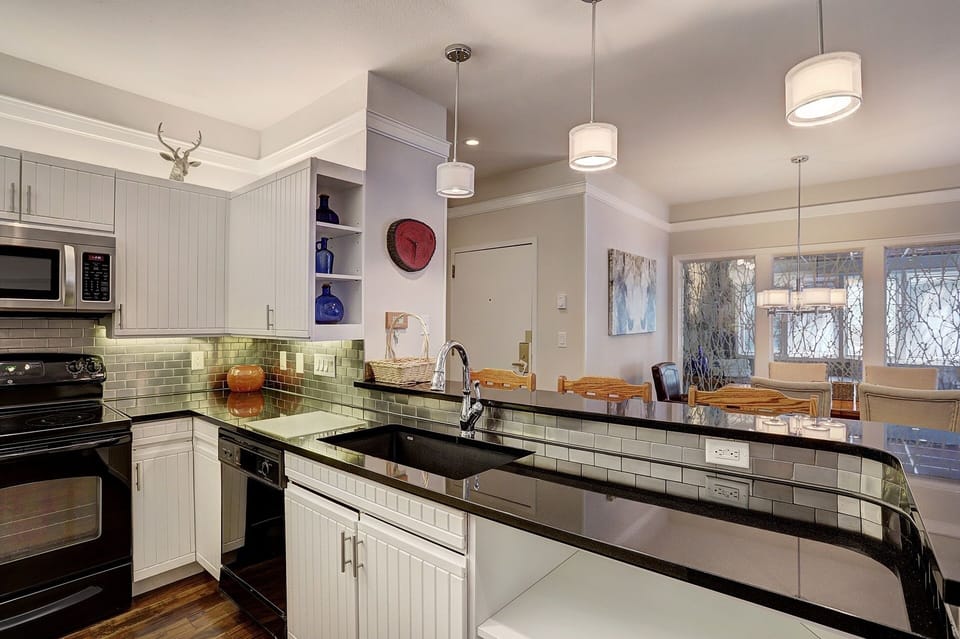 Condo, 2 Bedrooms | Private kitchen | Fridge, microwave, oven, stovetop
