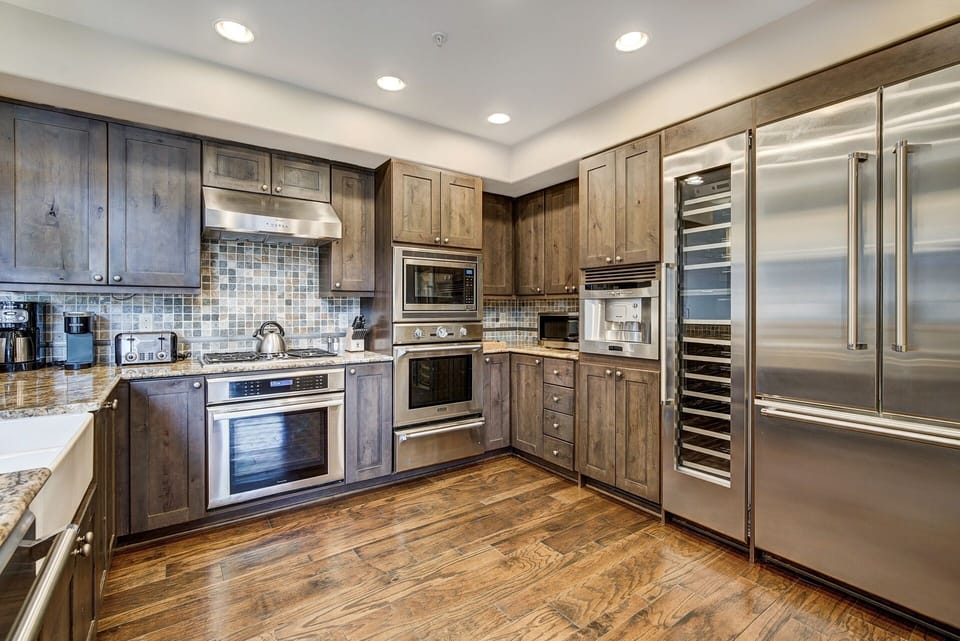 Condo, 4 Bedrooms | Private kitchen | Coffee/tea maker, full-size fridge, microwave, oven