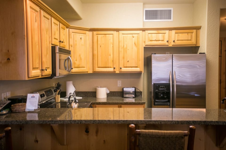 Condo, 2 Bedrooms | Private kitchen | Coffee/tea maker, full-size fridge, microwave, oven
