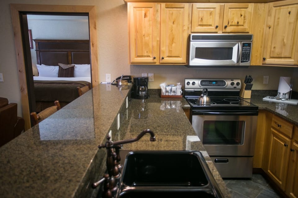 Condo, 2 Bedrooms | Private kitchen | Coffee/tea maker, full-size fridge, microwave, oven