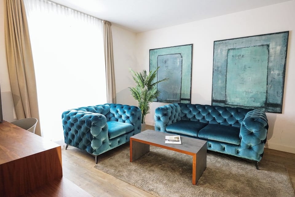 Superior Suite, Garden View | Living area | Flat-screen TV