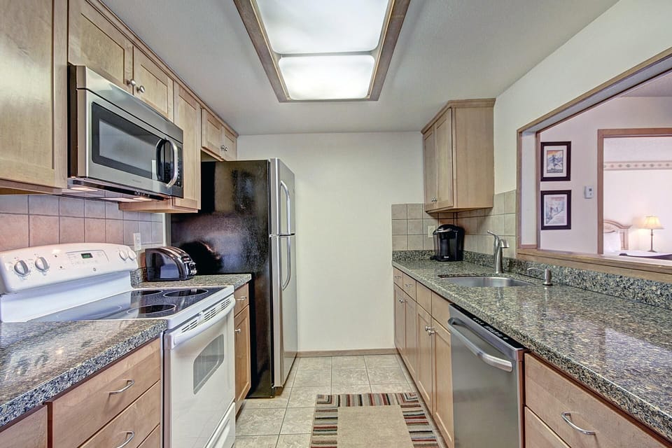 Condo, 2 Bedrooms | Private kitchen | Full-size fridge, microwave, oven, dishwasher