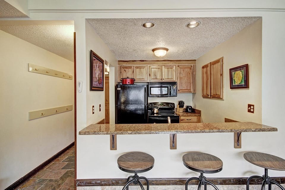 Condo, 2 Bedrooms | Private kitchen | Full-size fridge, microwave, oven, stovetop
